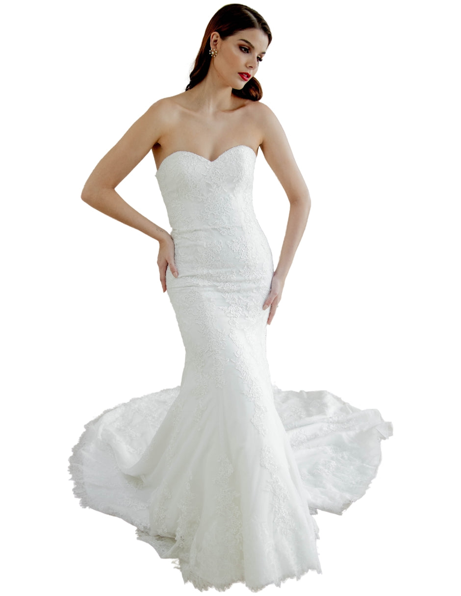 Anya vestido strapless falda sirena elaborado con delicado encaje. El escote corazón romántico y su diseño enmarca la silueta.